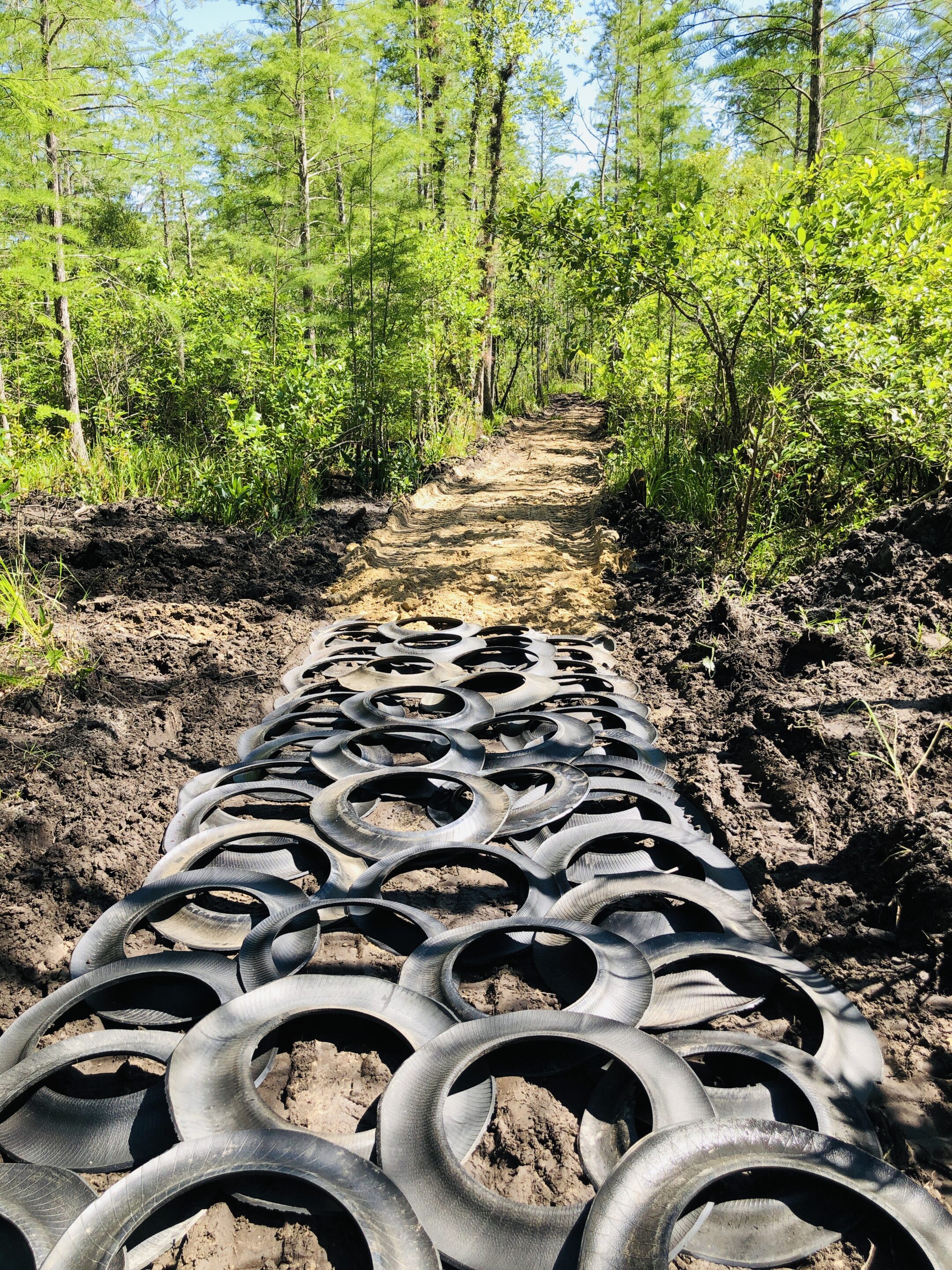 Road foundation with used tires