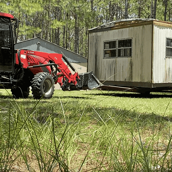 Tractor Moving Building